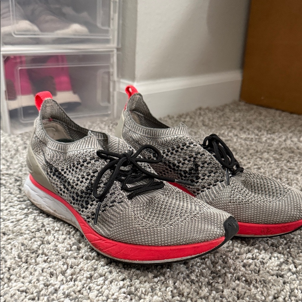 Nike Women's Grey Knit Running Shoes with Reddish Orange Accents